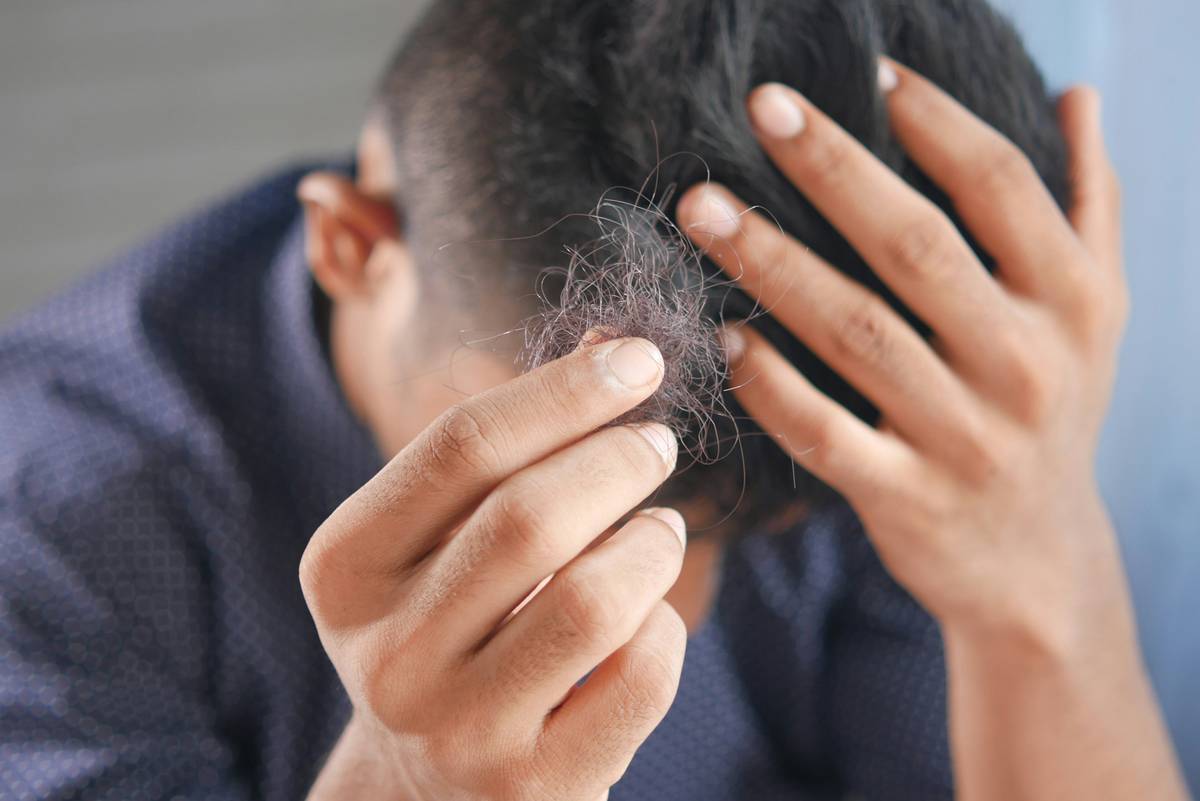Close-up of effective hair care vitamins and supplements capsules with ingredient labels